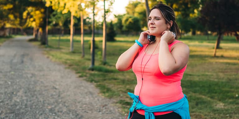 Lady on walk with headphones