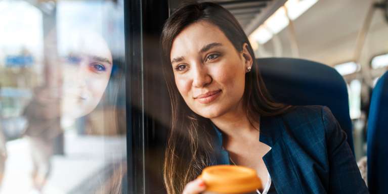Lady on train looking out of the window